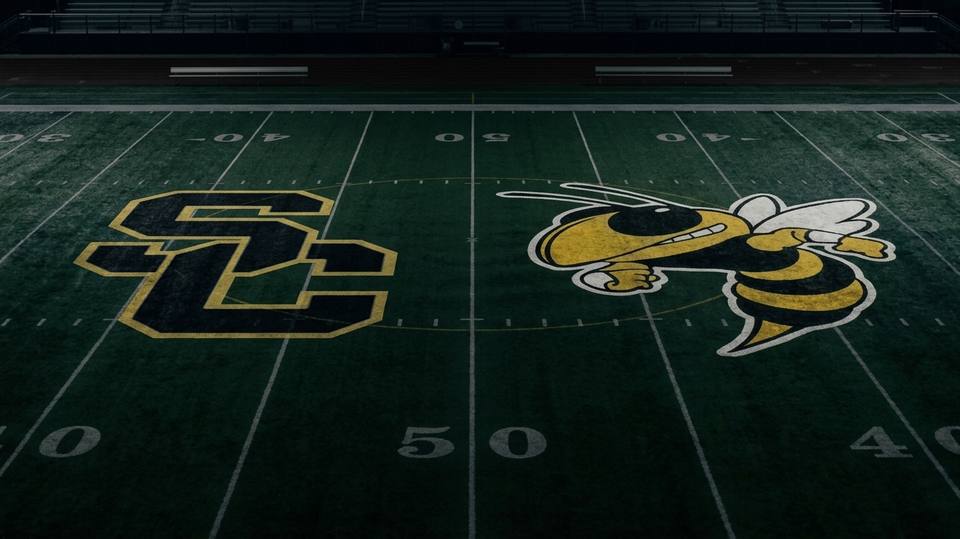 A graphic of a football field showing the Stewart County and Fairview Yellow Jacket logos facing off at midfield.