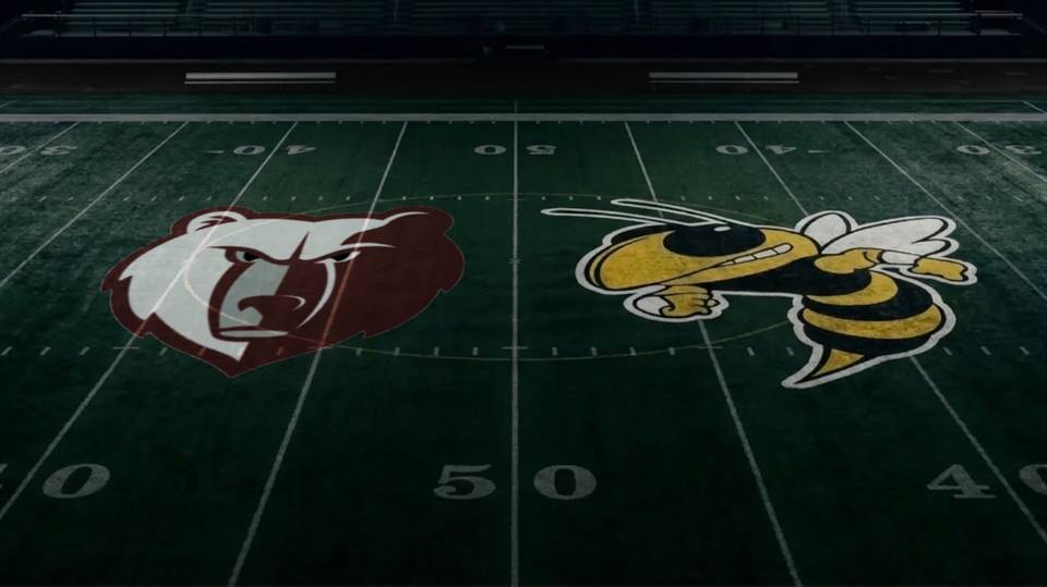 The Cheatham County Central Cubs and Fairview Yellow Jackets logos painted at midfield on a football field.